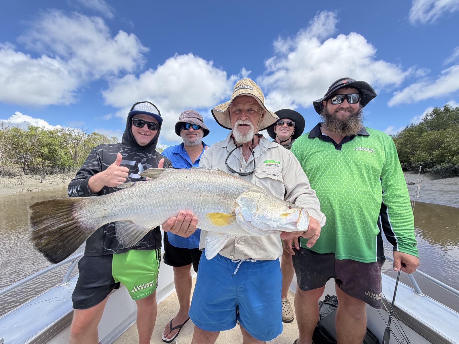 Group of anglers with a metre-long barramundi on a Cape Adieu Top End barra charter