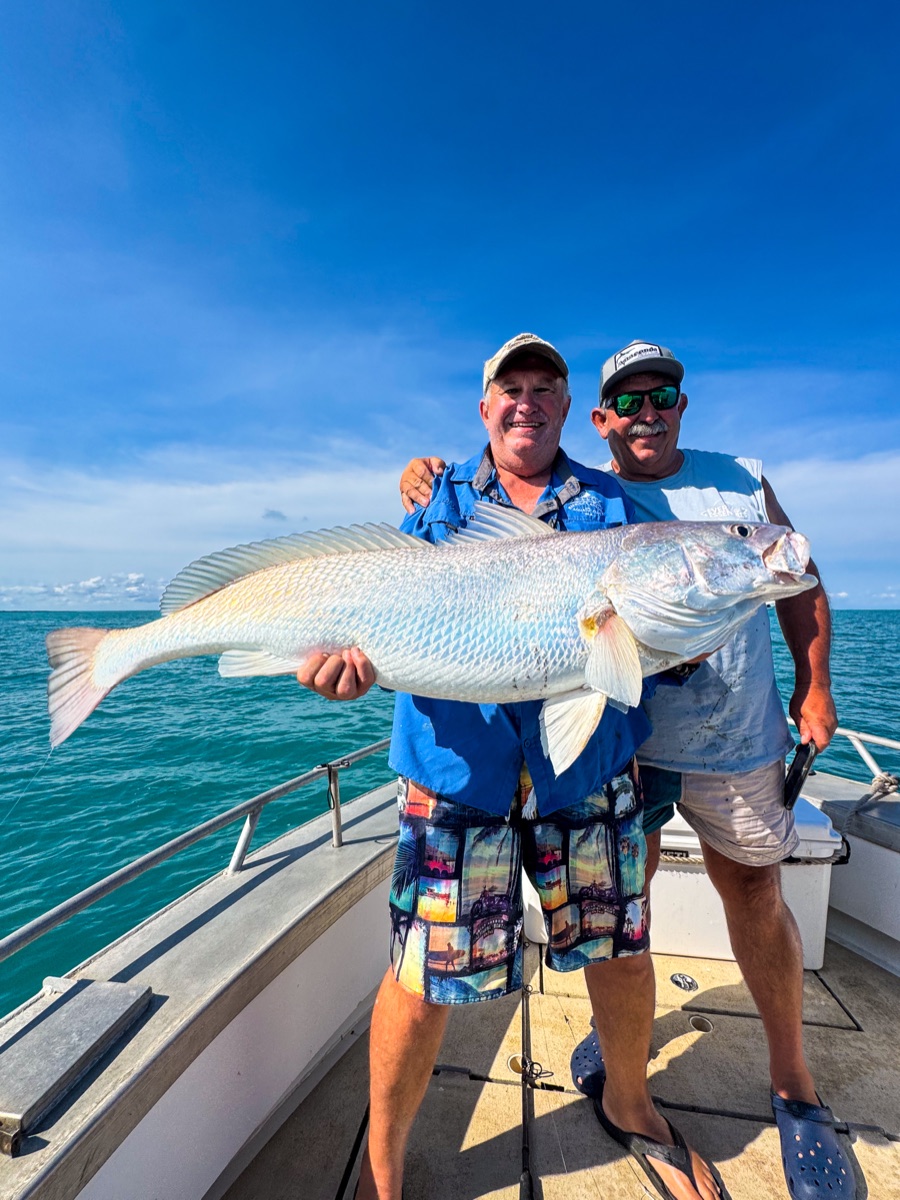 Two anglers with a black jewfish caught on a Darwin Harbour charter