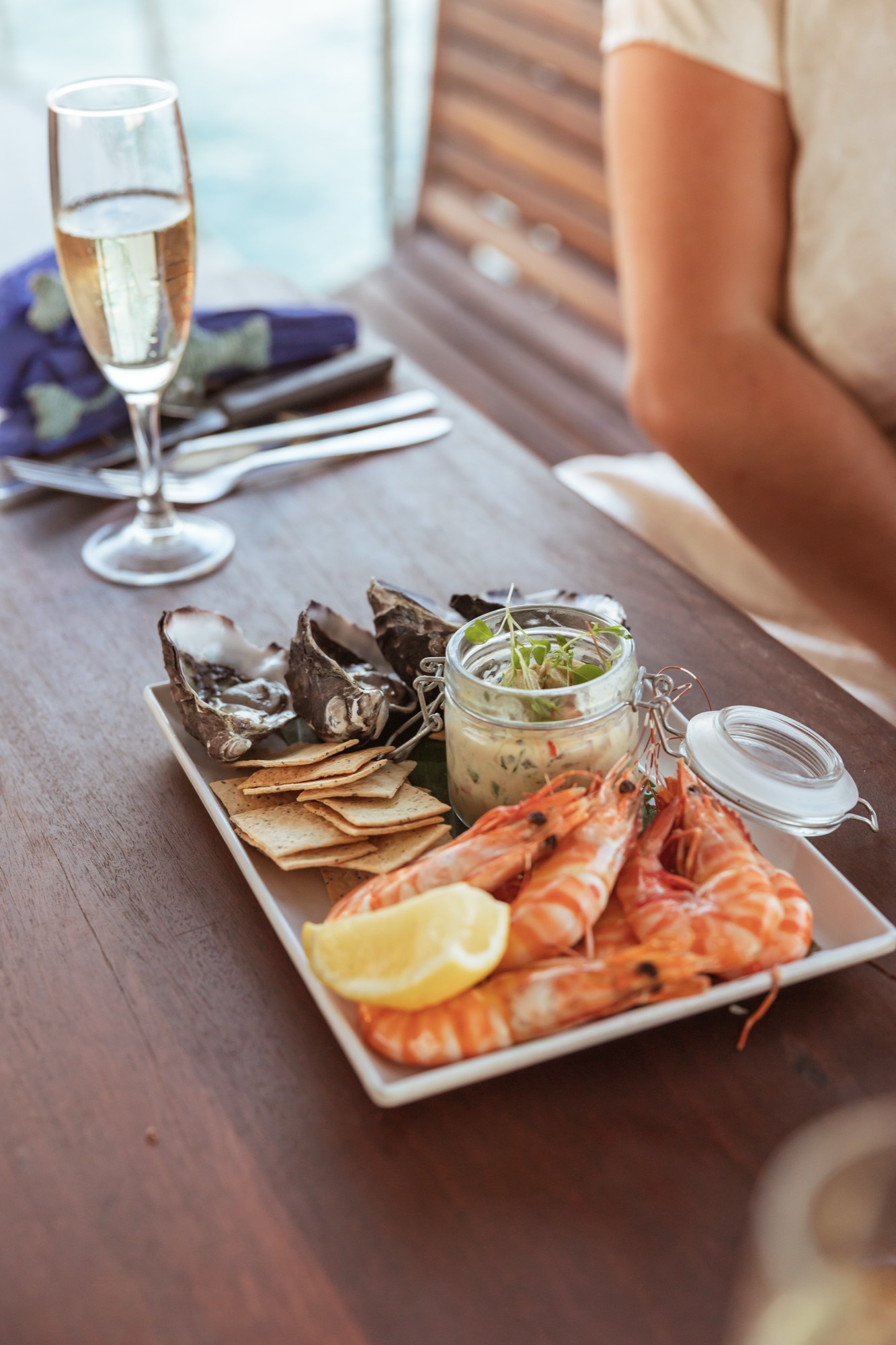 Prawn platter and champagne on the deck of a Darwin sundowner cruise