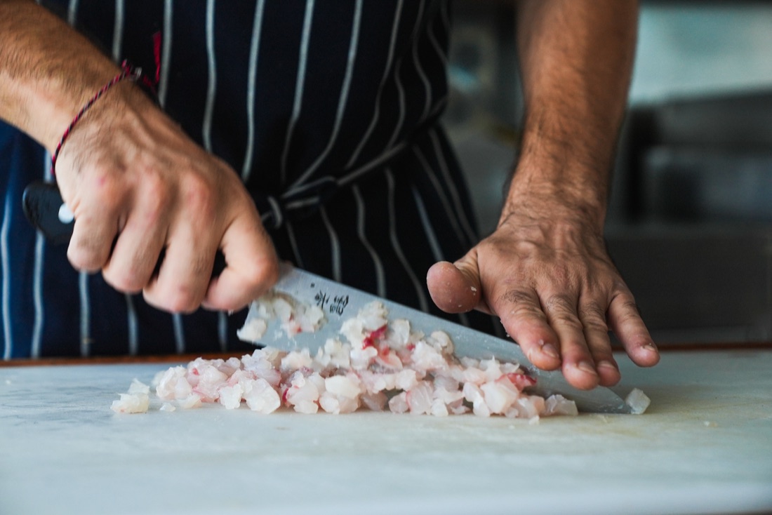 Chef preparing fresh food on board a Cape Adieu Darwin Harbour cruise