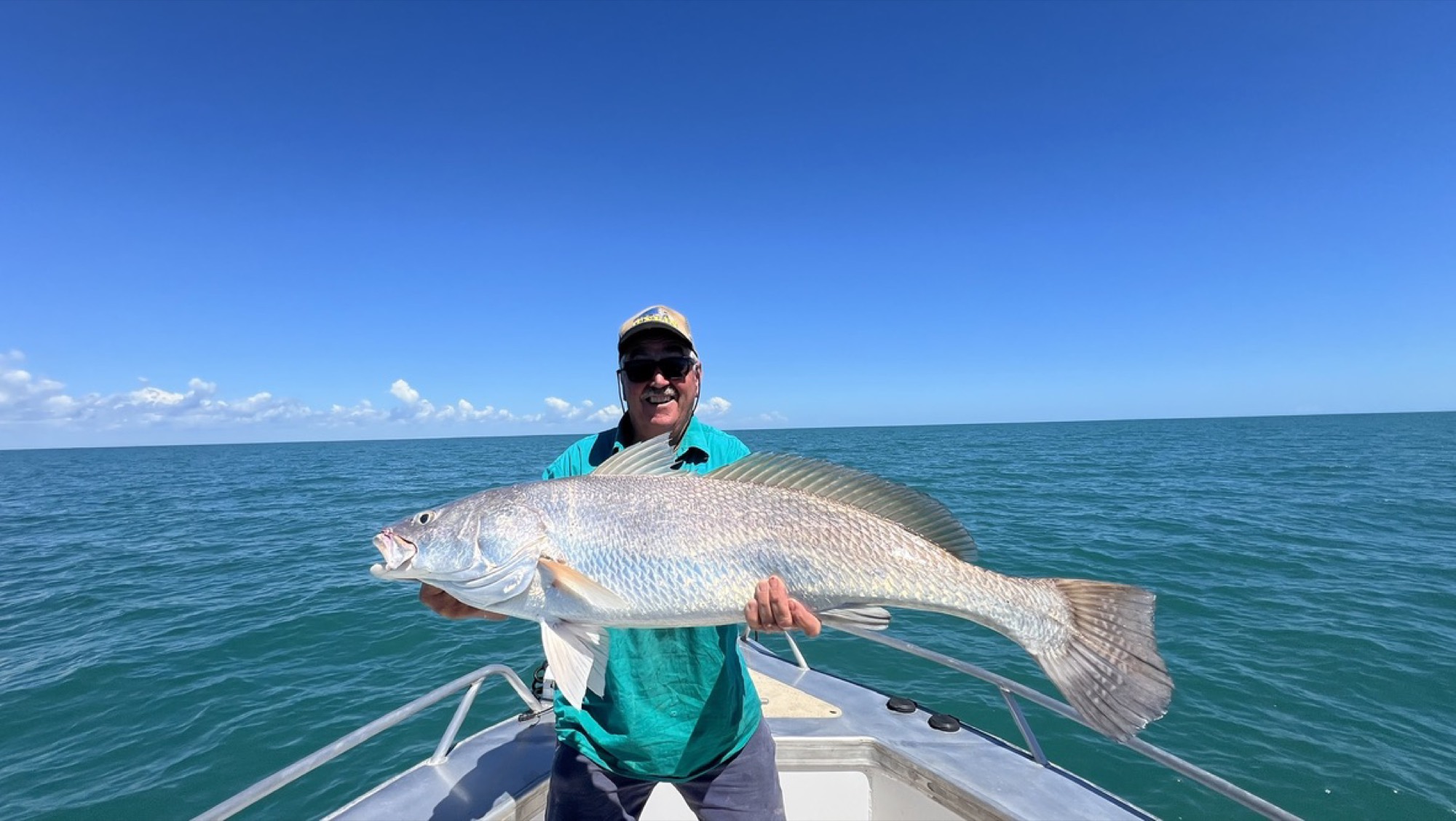 Angler with a large fingermark on a Darwin Harbour charter