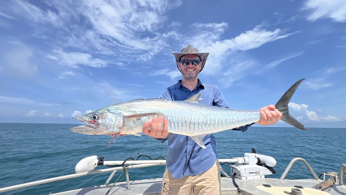 Angler holding a big Spanish mackerel caught offshore on the bluewater grounds off Darwin