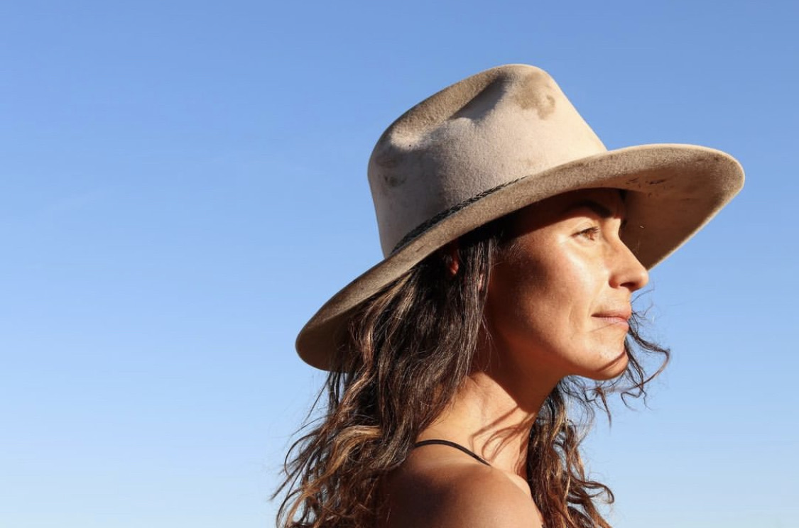 Grace Hardy in a bush hat under a Top End sky