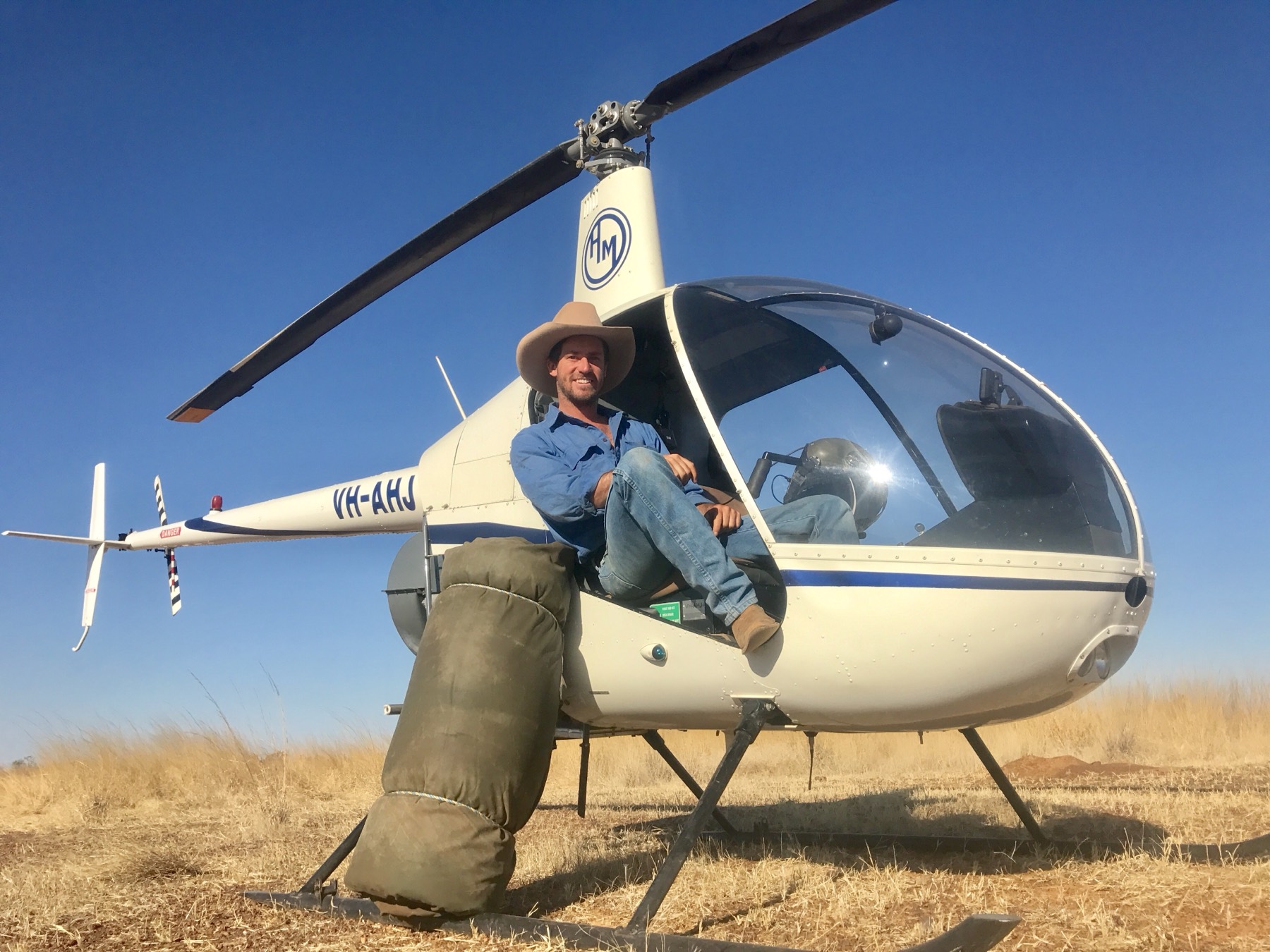 Munro Hardy sitting in a mustering helicopter on a Territory cattle station