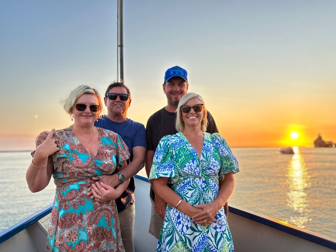 Group of guests watching the sunset aboard a Cape Adieu Darwin Harbour cruise